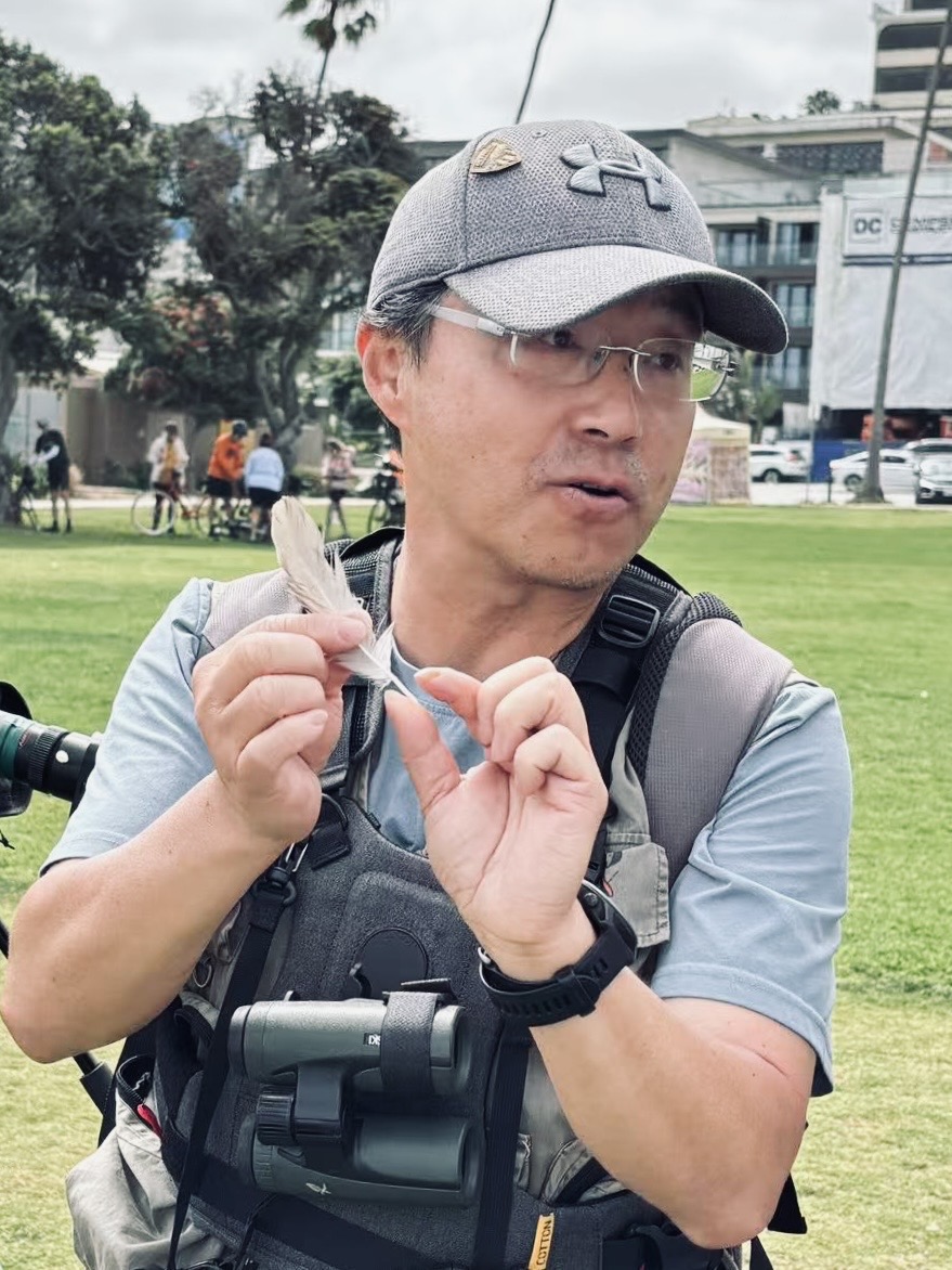 Leo Xiang leading a birdwatching activity in San Diego